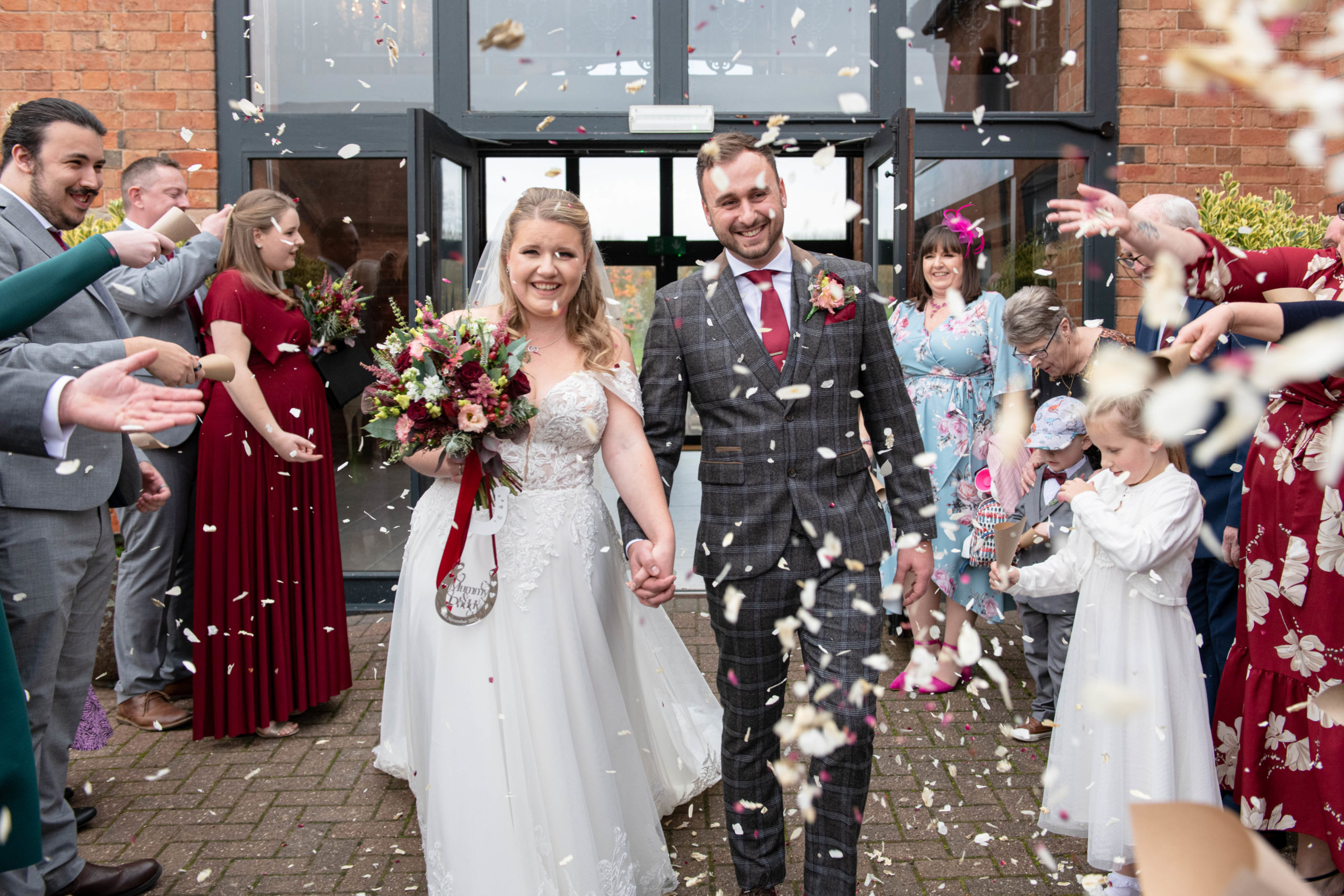 Confetti, newlyweds, the meadow barn, bride and groom