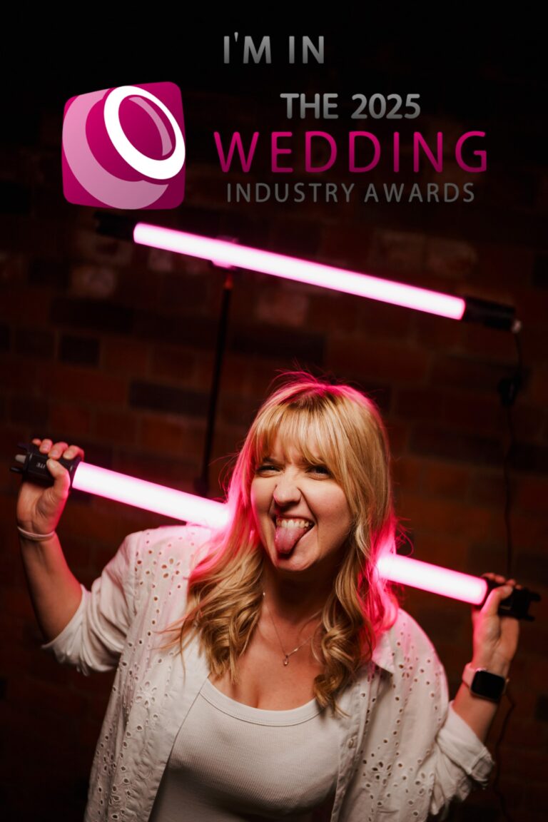 A joyous woman sticking out her tongue, holding a pink neon light tube with text overlay "I'M IN THE 2025 WEDDING INDUSTRY AWARDS" with a logo in the background.